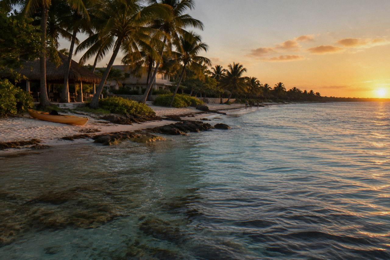 Turquoise bay with calm water, seagrass beds and palm trees along a white sand shoreline