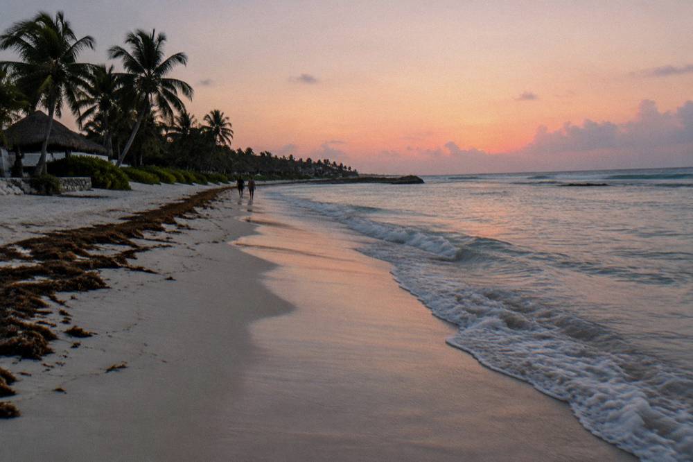 Early morning light on an empty beach with gentle waves